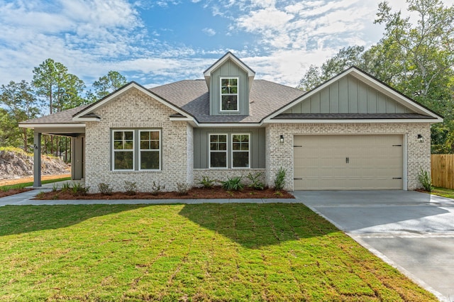 view of front of home with a garage and a front yard