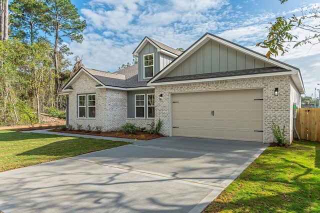 76 Azalea Dr, Freeport, FL 32439 - view of front of house with brick siding, an attached garage, driveway, and board and batten siding