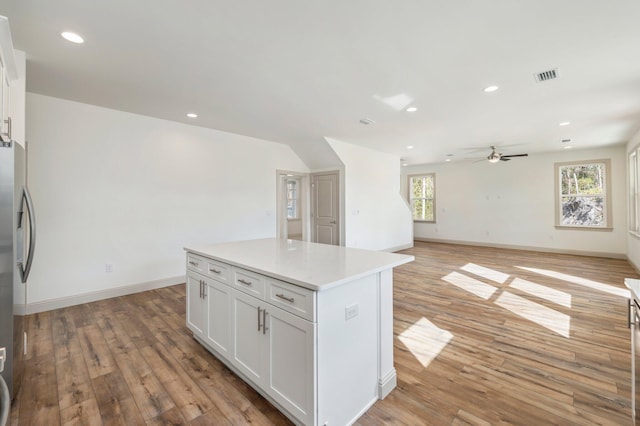 76 Azalea Dr, Freeport, FL 32439 - kitchen with freestanding refrigerator, white cabinetry, a ceiling fan, light countertops, and recessed lighting