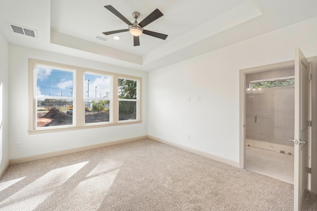 76 Azalea Dr, Freeport, FL 32439 - empty room with carpet floors, a tray ceiling, baseboards, and ceiling fan