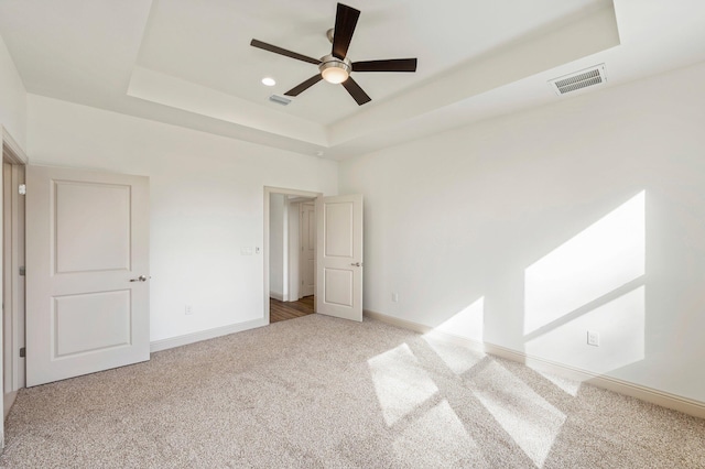 76 Azalea Dr, Freeport, FL 32439 - unfurnished bedroom featuring carpet, a raised ceiling, baseboards, and ceiling fan