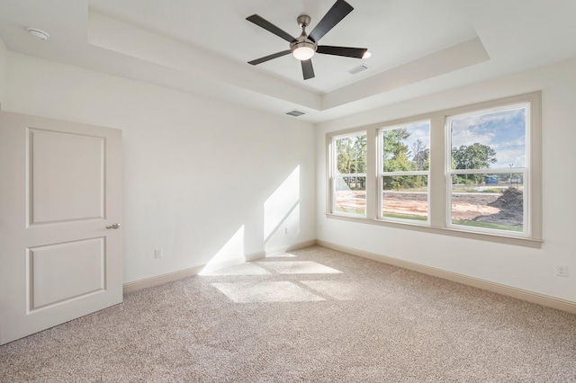 76 Azalea Dr, Freeport, FL 32439 - carpeted spare room featuring a raised ceiling, baseboards, and ceiling fan