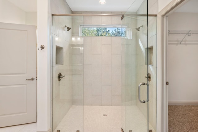 76 Azalea Dr, Freeport, FL 32439 - bathroom with a stall shower and a walk in closet