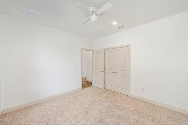 76 Azalea Dr, Freeport, FL 32439 - unfurnished bedroom featuring light carpet, baseboards, a closet, and ceiling fan
