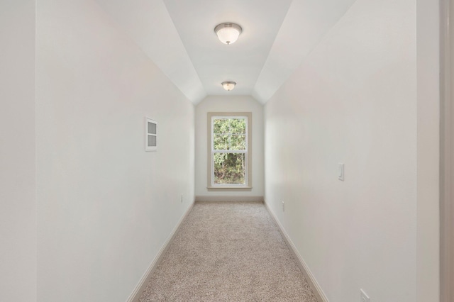 76 Azalea Dr, Freeport, FL 32439 - corridor with light carpet, baseboards, and lofted ceiling