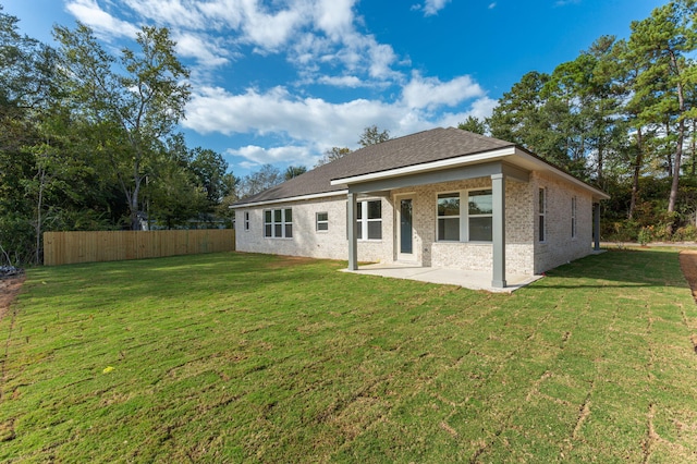 76 Azalea Dr, Freeport, FL 32439 - back of property with a patio area and brick siding