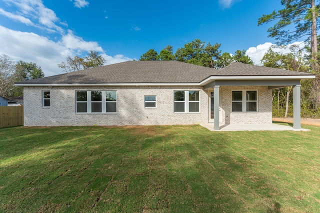 76 Azalea Dr, Freeport, FL 32439 - rear view of property featuring a patio, brick siding, and roof with shingles