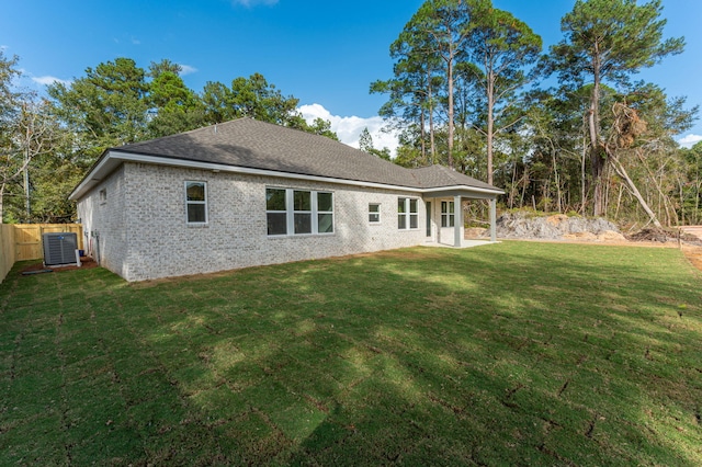 76 Azalea Dr, Freeport, FL 32439 - rear view of property featuring central air condition unit and brick siding
