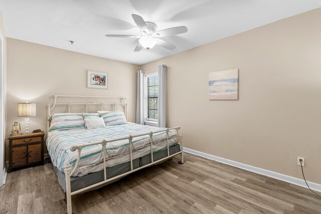 bedroom featuring ceiling fan and wood-type flooring