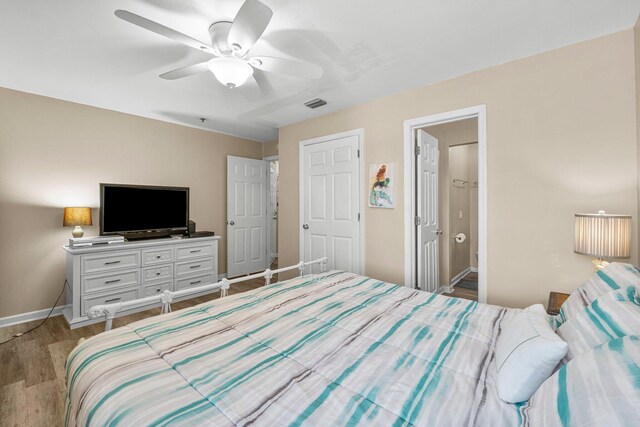 bedroom featuring hardwood / wood-style flooring and ceiling fan