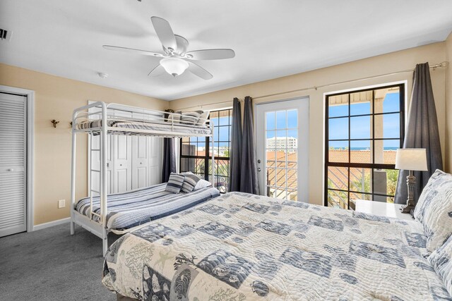 carpeted bedroom with ceiling fan and access to outside