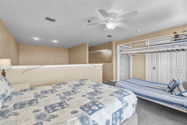 bedroom featuring ceiling fan, carpet, and a closet