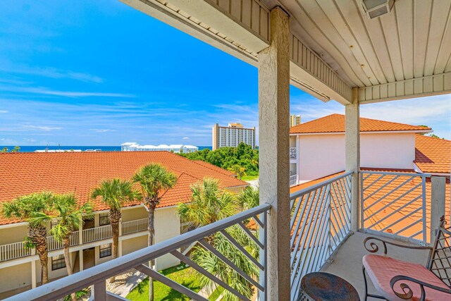 balcony featuring a water view