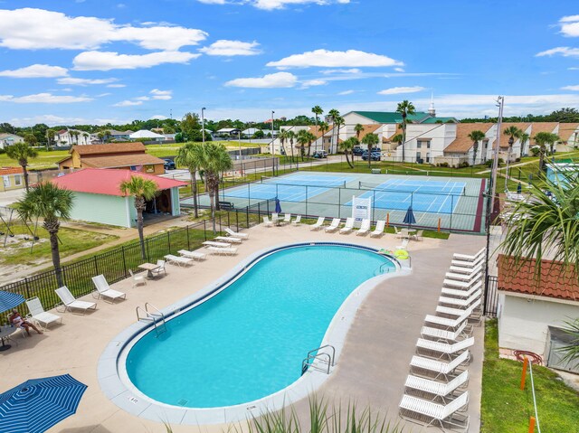 view of swimming pool with a patio area