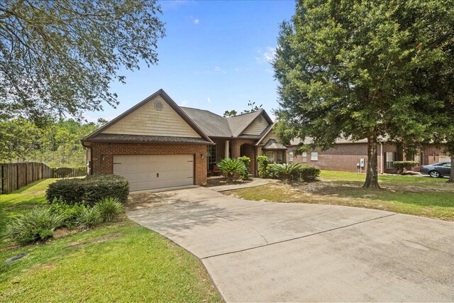 view of front of home with a front lawn and a garage