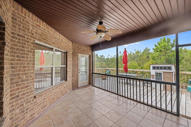 view of patio / terrace with ceiling fan and a balcony