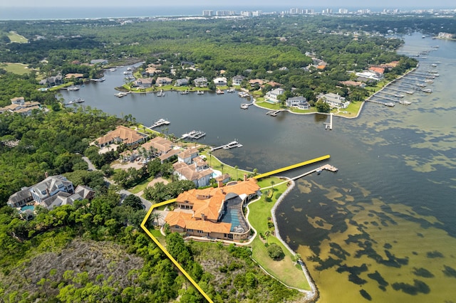 drone / aerial view featuring a water view and a residential view