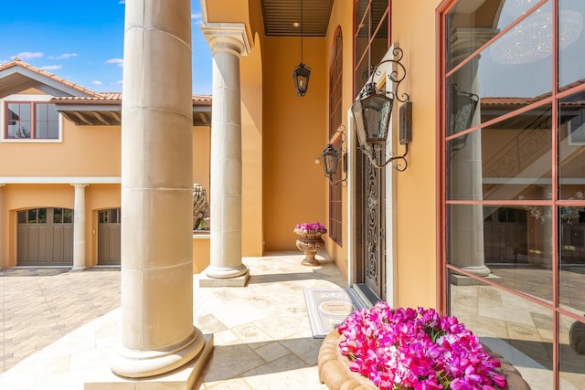entrance to property with stucco siding