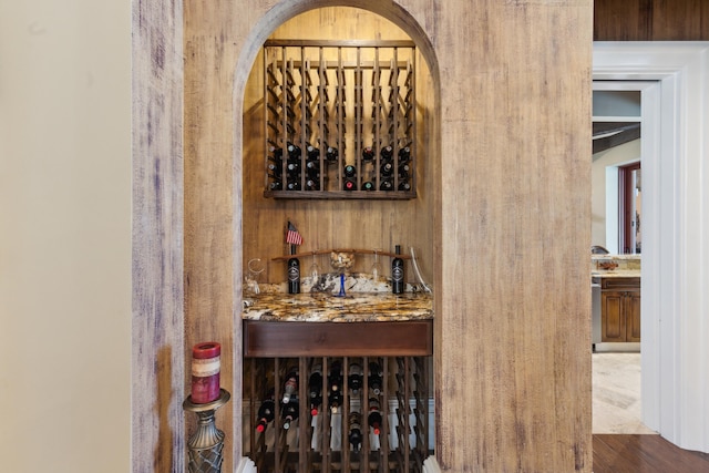 wine room with wood finished floors