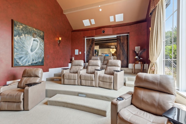 home theater featuring carpet and high vaulted ceiling