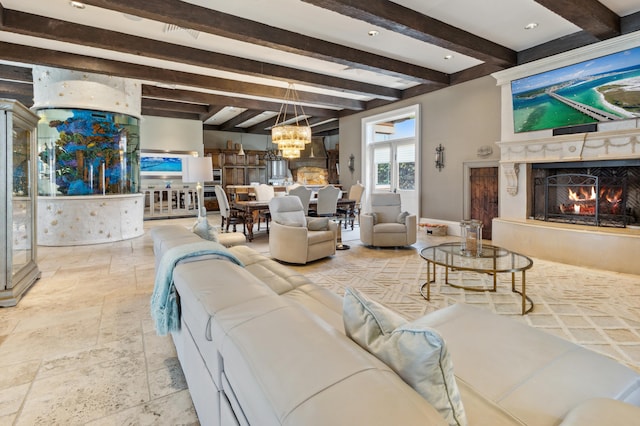 tiled living room with beam ceiling, a premium fireplace, and a chandelier