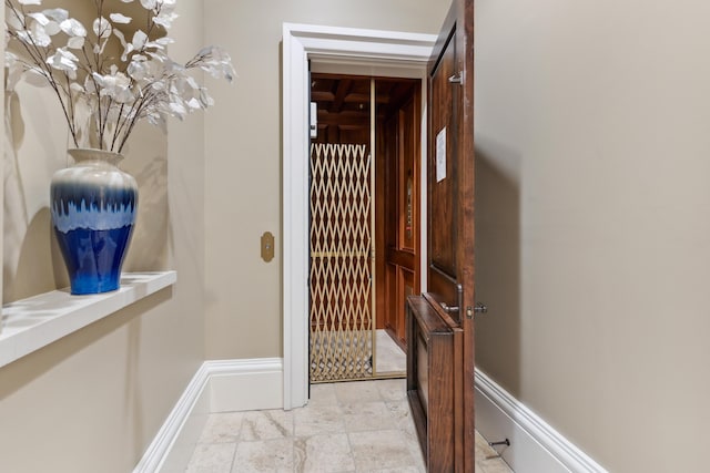 hallway with light tile patterned floors