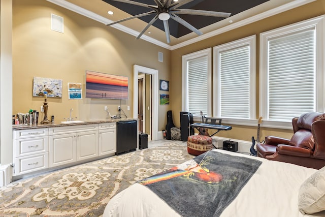 bedroom with sink, crown molding, refrigerator, and carpet flooring