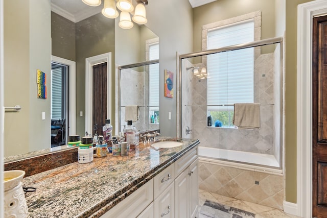 bathroom featuring crown molding, tile patterned floors, and vanity