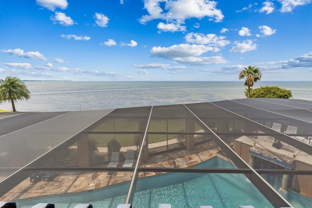 view of pool with a water view