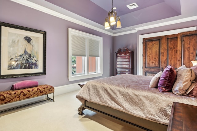 carpeted bedroom with ornamental molding, a tray ceiling, a chandelier, and visible vents