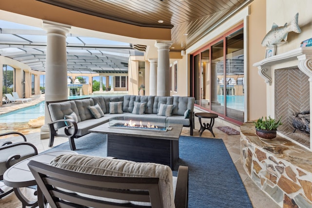 view of patio / terrace with an outdoor living space with a fire pit