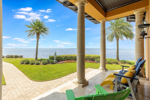 view of patio with a water view