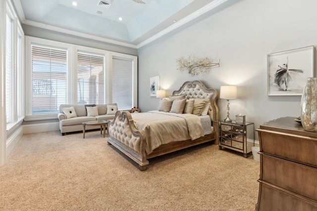 bedroom featuring a raised ceiling, light carpet, baseboards, visible vents, and ornamental molding