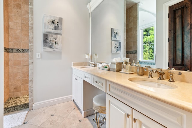 bathroom with double vanity and tile patterned floors