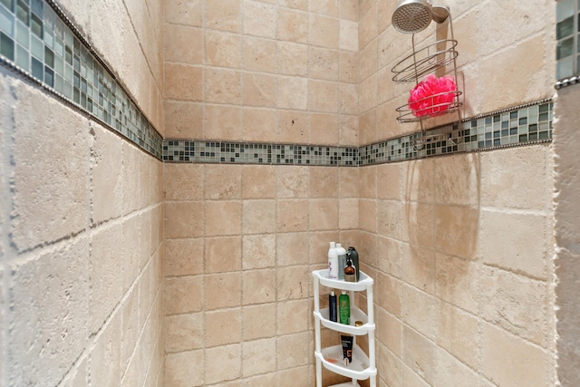 bathroom with a tile shower