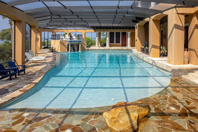 view of pool featuring pool water feature and a patio area