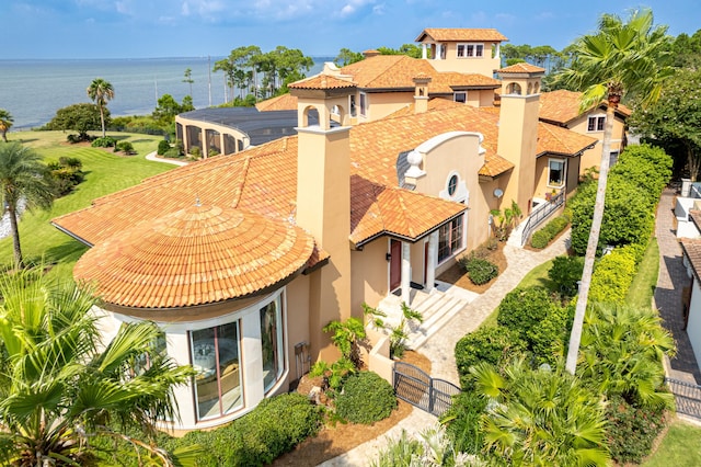 birds eye view of property with a water view