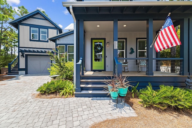 view of front facade with a garage and covered porch