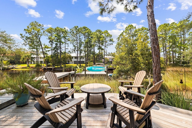 121 Shannon Dr, Santa Rosa Beach, FL 32459 - deck featuring a water view and a fire pit