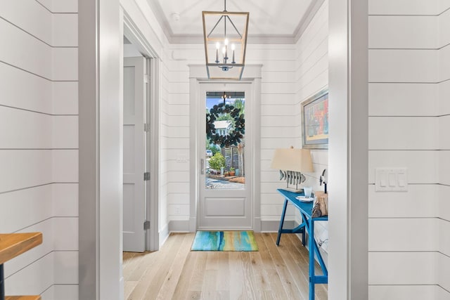 121 Shannon Dr, Santa Rosa Beach, FL 32459 - interior space with crown molding, light wood-type flooring, and a notable chandelier
