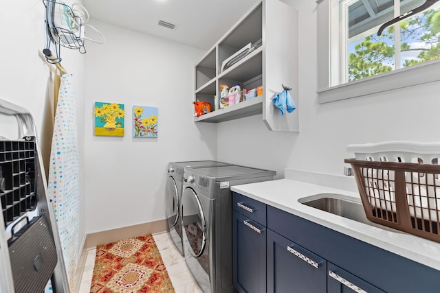 121 Shannon Dr, Santa Rosa Beach, FL 32459 - laundry room featuring visible vents, baseboards, marble finish floor, cabinet space, and washer and clothes dryer