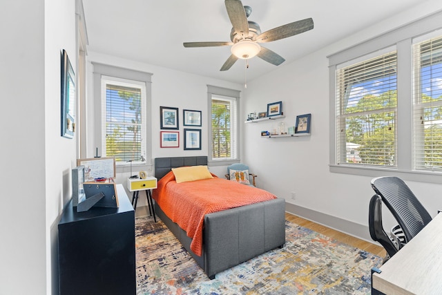 121 Shannon Dr, Santa Rosa Beach, FL 32459 - bedroom with ceiling fan, baseboards, and wood finished floors
