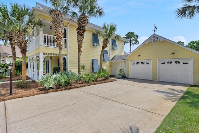 view of front facade featuring a garage and a balcony