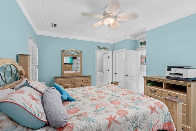 bedroom with ornamental molding and ceiling fan