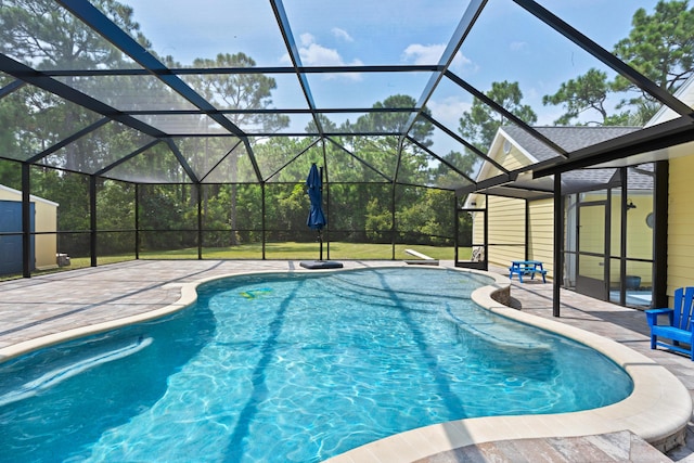 view of swimming pool with a yard, a lanai, and a patio