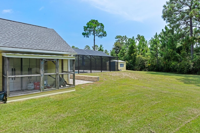 view of yard featuring glass enclosure