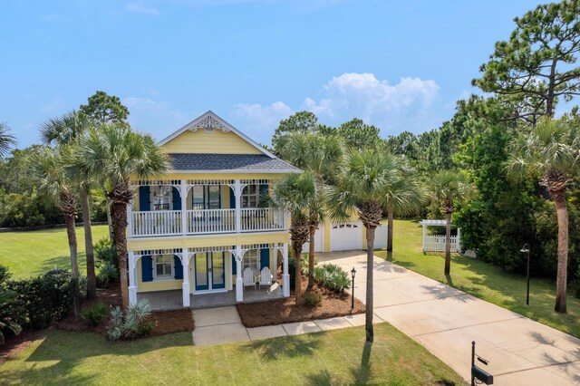 view of front of home with covered porch and a front lawn