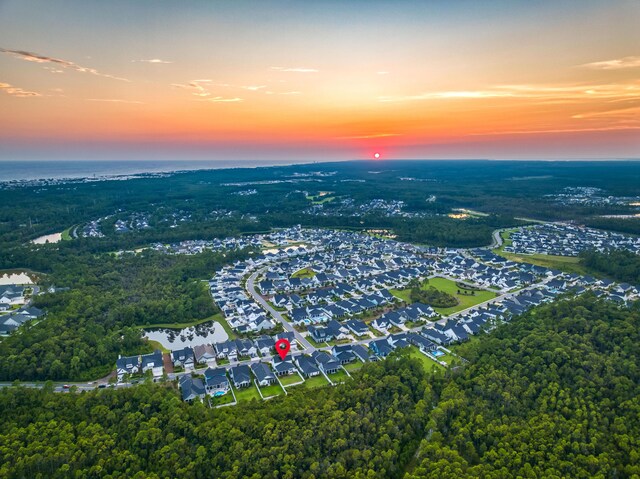 aerial view at dusk with a water view