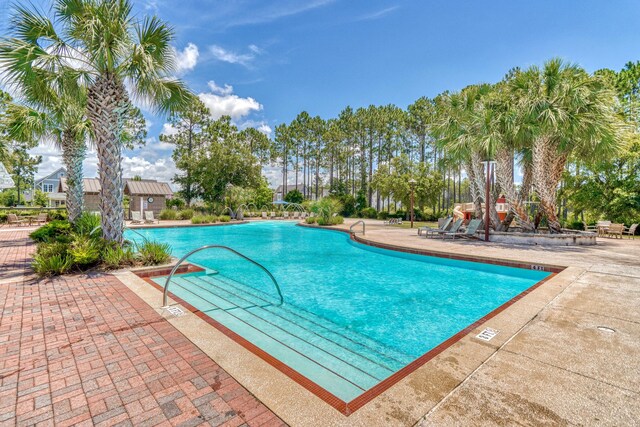 view of pool featuring a patio area