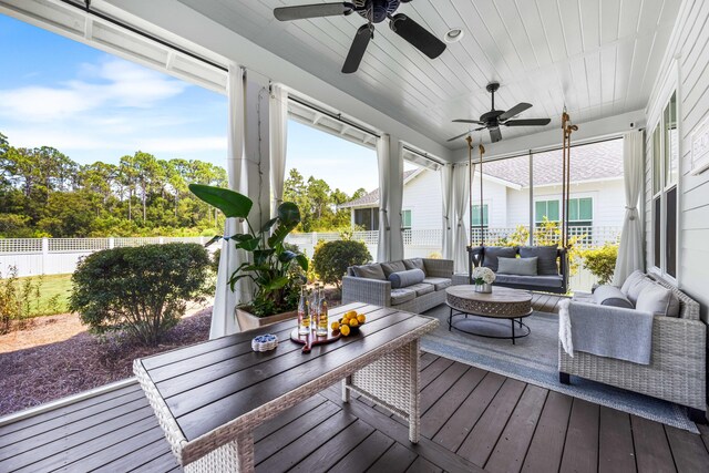 sunroom / solarium with ceiling fan